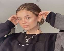 She has piercings in her ears and looks fabulous when she wears big earrings.